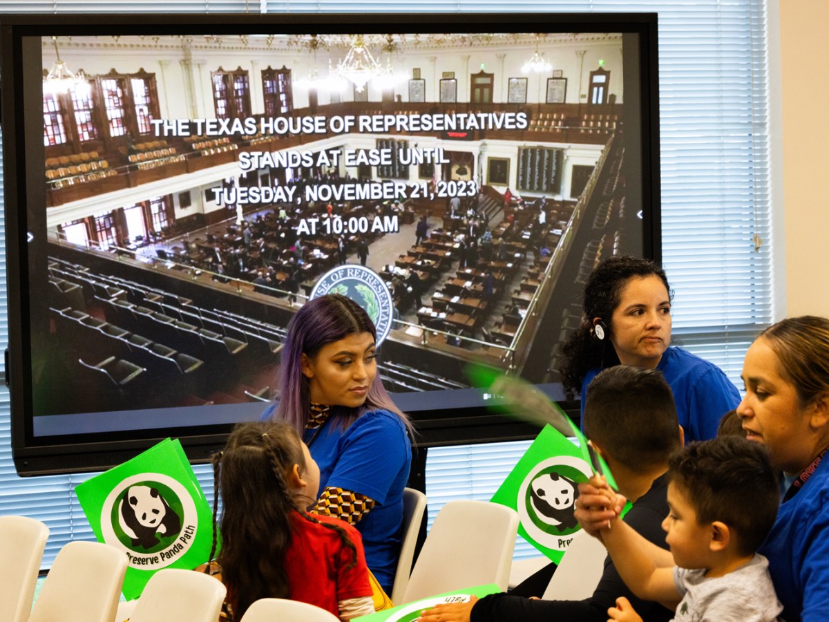 Yamileth Alvarado and her daughter Yvonne Aleman, 4, sit in front of a television screen announcing the end of a Texas House of Representatives meeting on which the legislators voted to strip school vouchers from the chamber’s education funding bill, Friday, Nov. 17, 2023, in Houston
