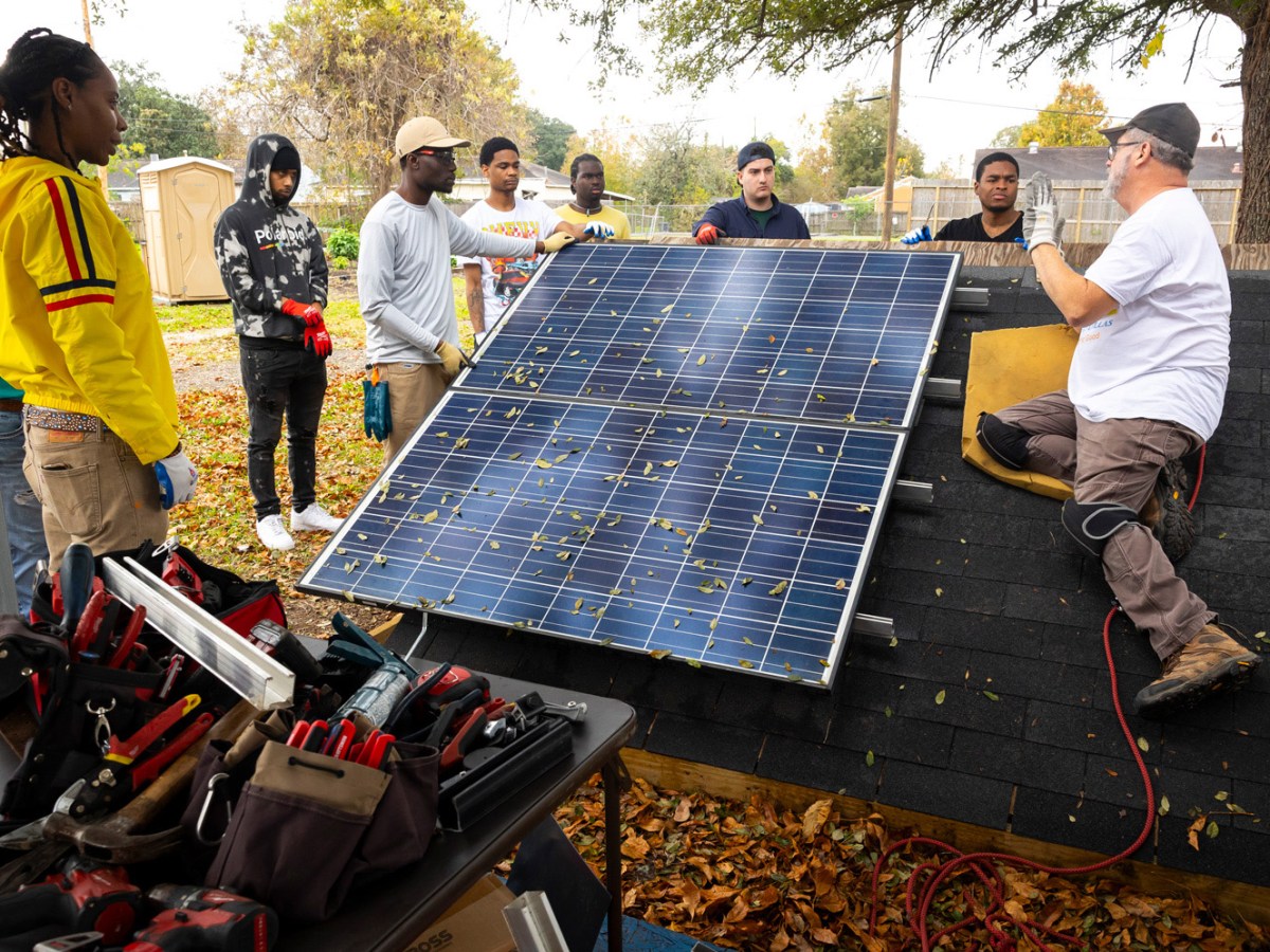 Participants listen to Mark McCollum, lead instructor for Green Careers Texas, during a solar panel installation training hosted by South Union Community Development Corporation on Friday, Dec. 8, 2023, in Sunnyside.