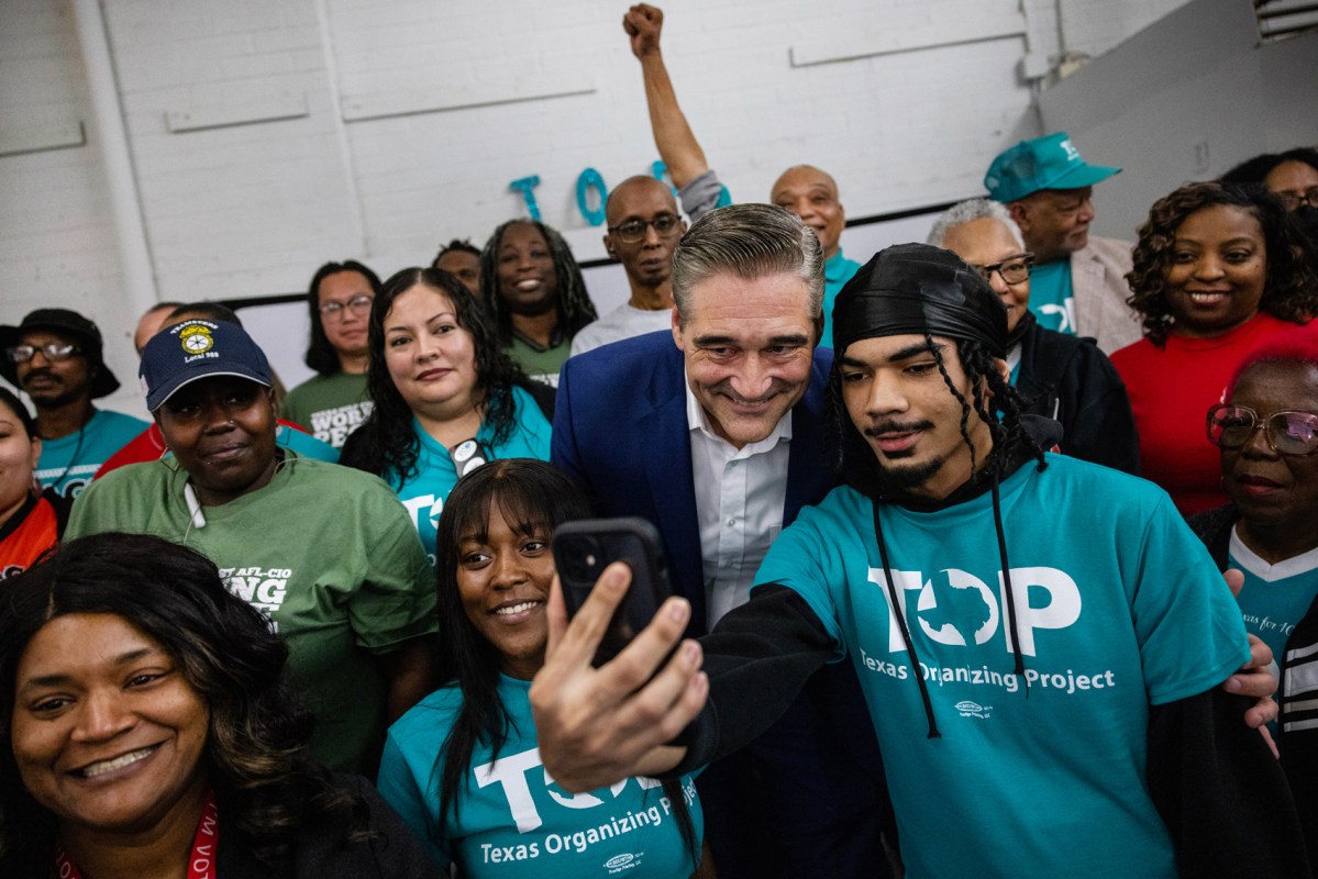 Sean Teare, candidate for Harris County District Attorney, takes a group photo after he received an endorsement by the Texas Organizing Project, Monday, Feb. 5, 2024, in Houston.