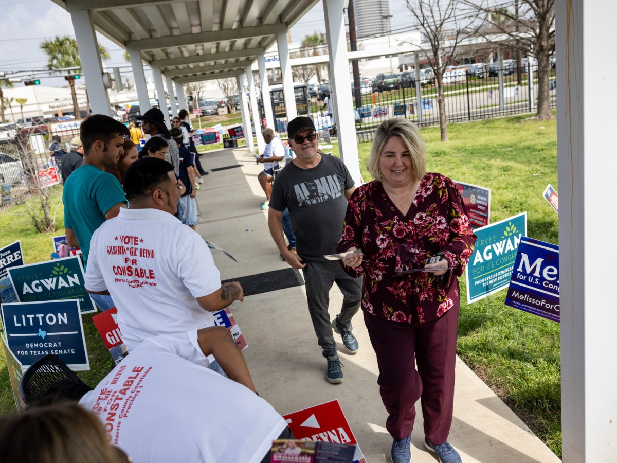 Voters walk past campaign volunteers outside the Metropolitan Multi-Service Center on Super Tuesday, Tuesday, March 5, 2024, in Houston.