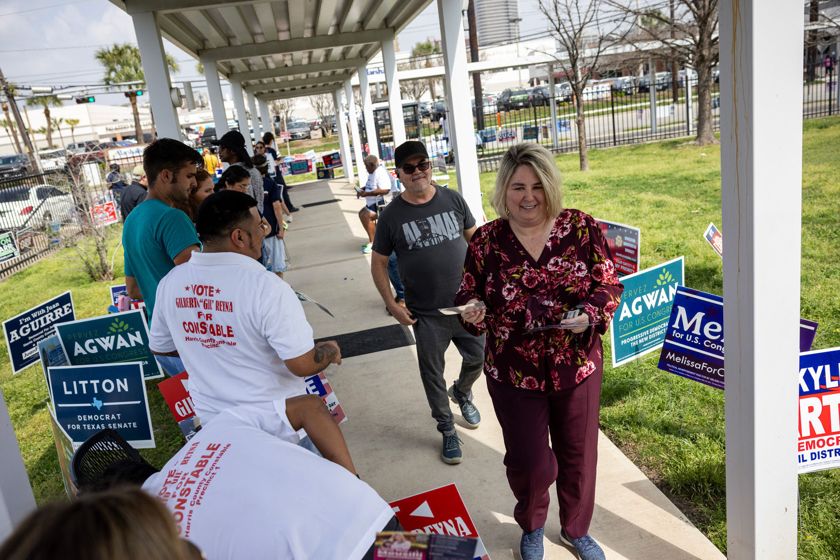 Voters walk past campaign volunteers outside the Metropolitan Multi-Service Center on Super Tuesday, Tuesday, March 5, 2024, in Houston.