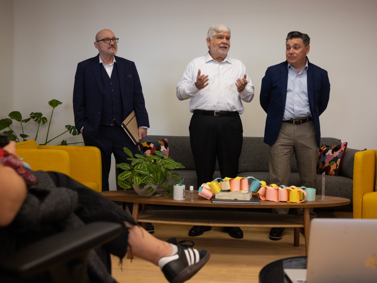 Houston Landing CEO Peter Bhatia, at center, introduces Manny Garcia, the Landing's new editor in chief, at left, and Angel Rodriguez, the new managing editor, at right, during an all-hands meeting at the Houston Landing.