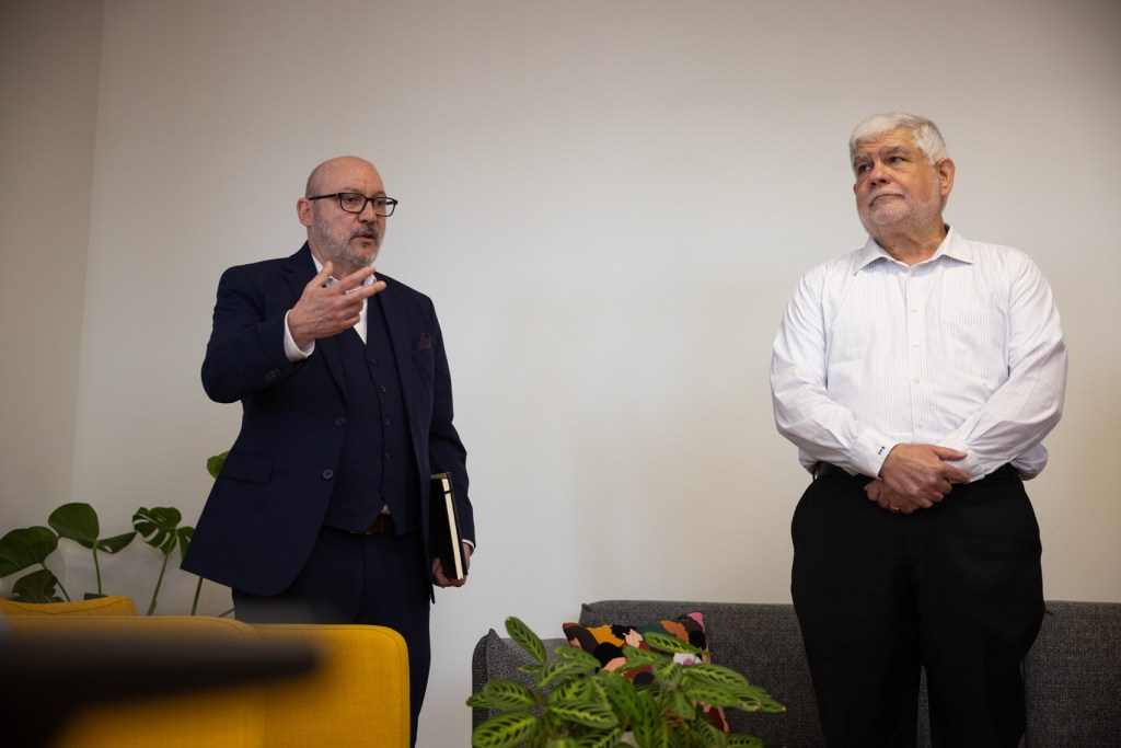 Manny Garcia, editor in chief, at left, speaks as Peter Bhatia, CEO, listens during an All-hands meeting at the Houston Landing, Friday, March 15, 2024, in Houston. 