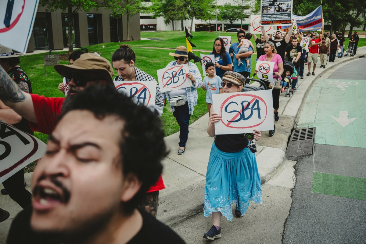 Dozens of people marched in opposition of Texas Senate Bill 4 in downtown Houston, on March 30, 2023.