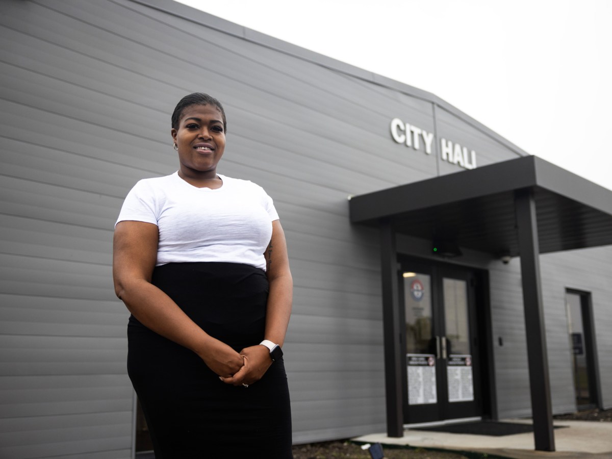 Ebony Sanco, council member, poses for a portrait outside of Arcola City Hall