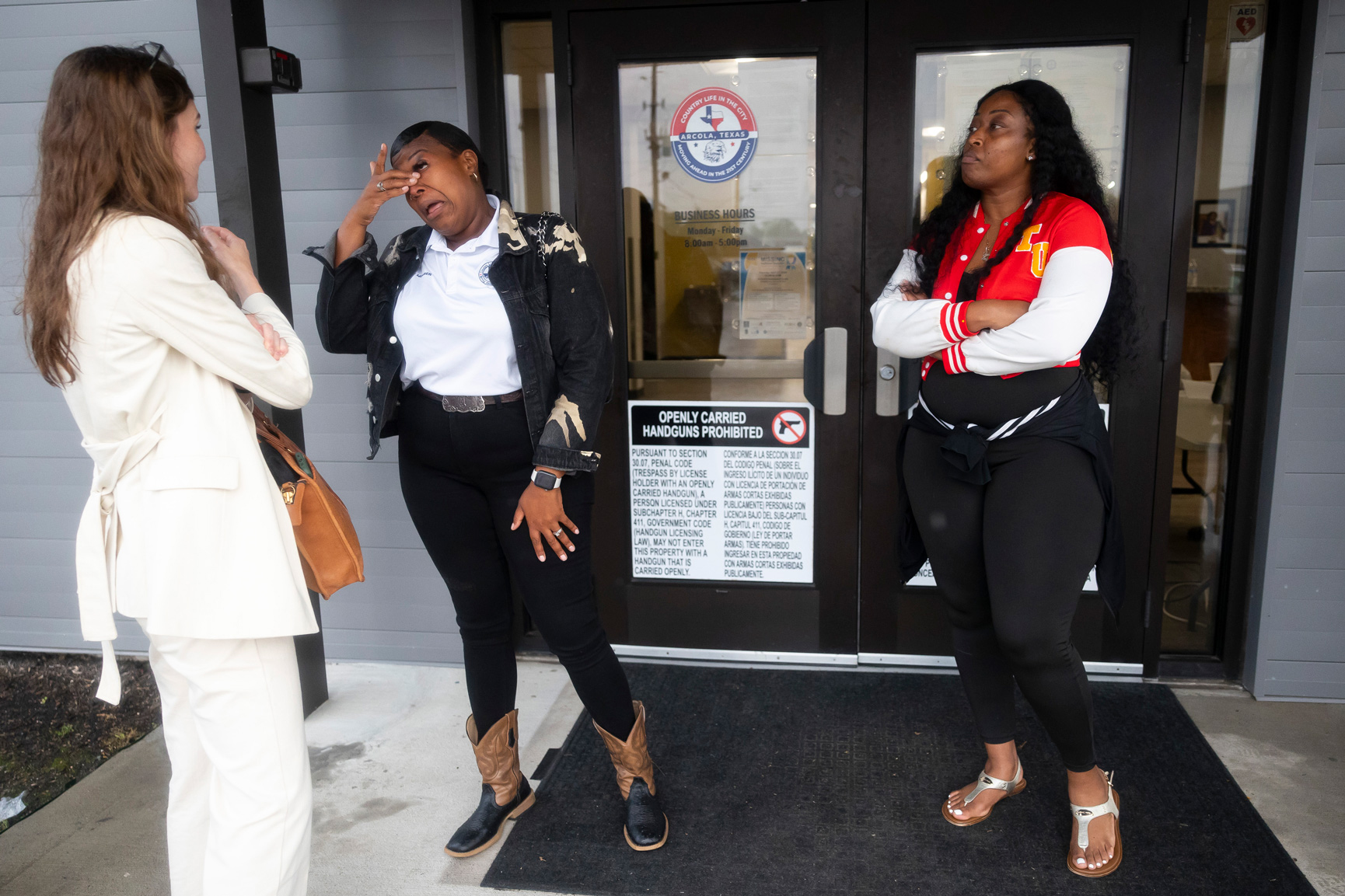 City council member Ebony Sanco wipes a tear from her eye after receiving encouragement on Tuesday,