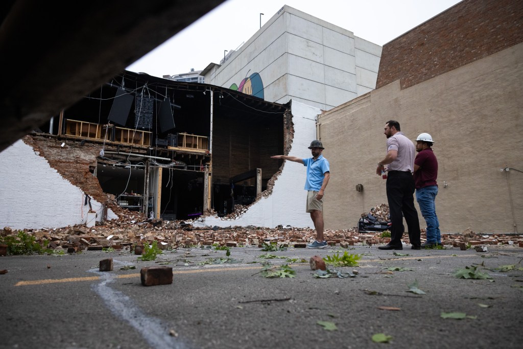 People survey a partially collapsed section of Conejo Malo in downtown, Friday, May 17, 2024, in Houston.