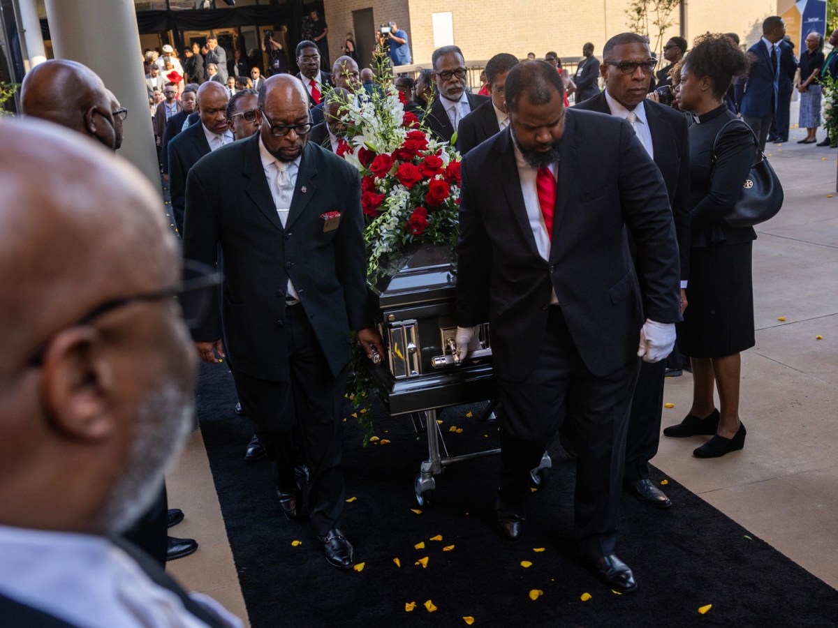 The casket of Rev. William A. Lawson is moved down to the Wheeler Avenue Baptist Church during his memorial service, Thursday, May 23, 2024, in Houston.
