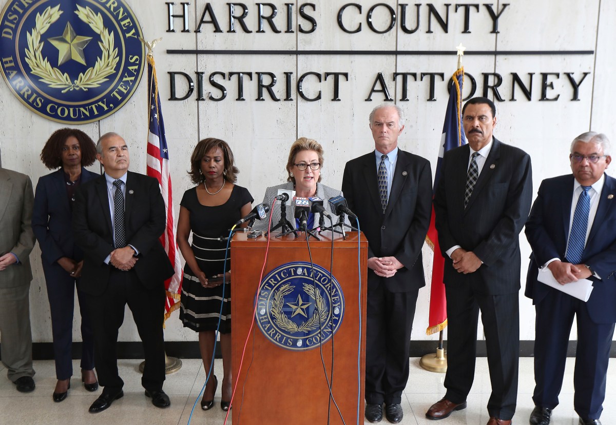 Harris County District Attorney Kim Ogg announces that her office has charged two officers in the Harding Street Raid Friday, Aug. 23, 2019, in Houston. A former Houston police officer has been charged with murder in connection with the deadly January drug raid of a home that killed a couple who lived there and injured five officers, prosecutors announced Friday.