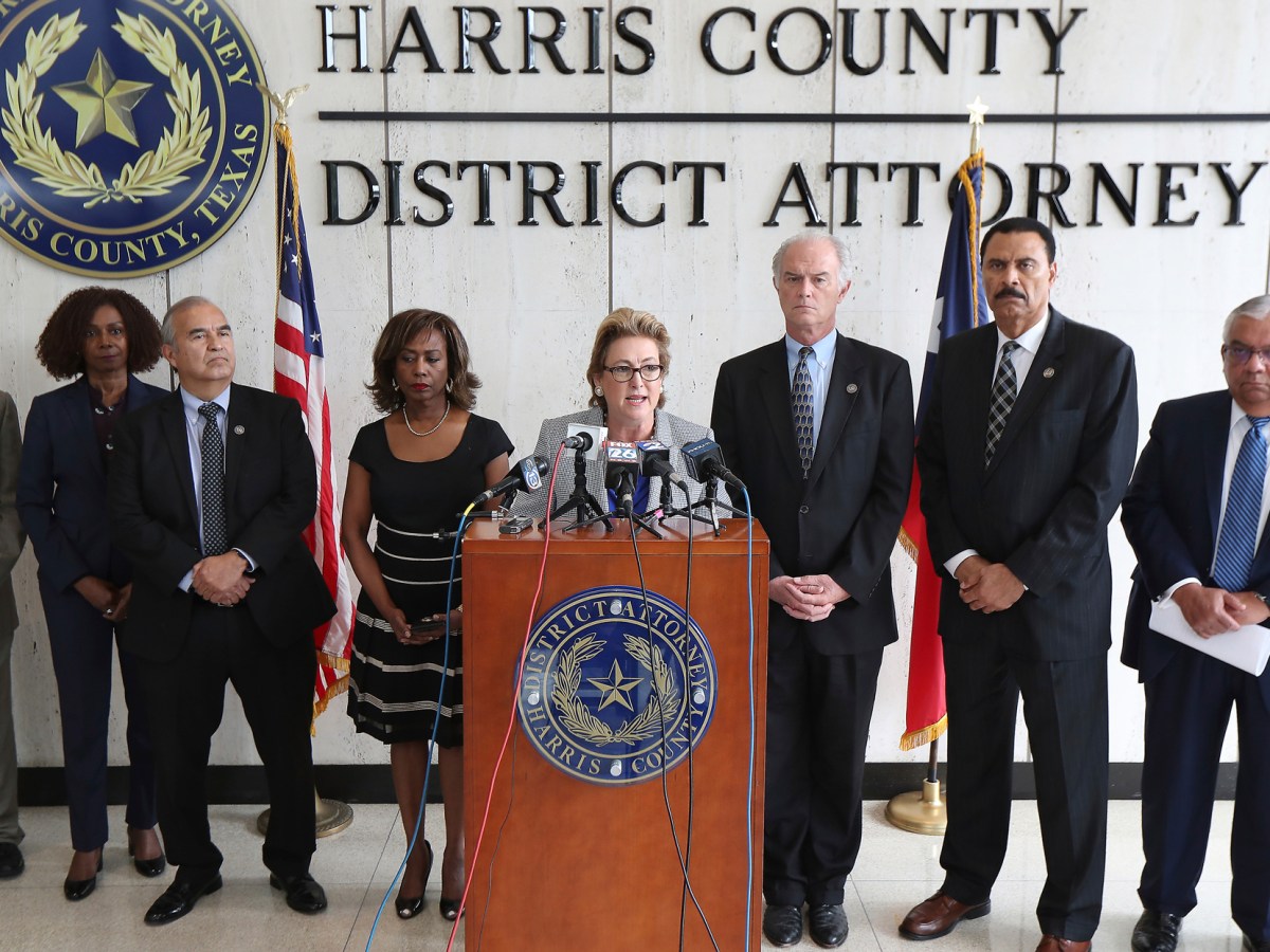 Harris County District Attorney Kim Ogg announces that her office has charged two officers in the Harding Street Raid Friday, Aug. 23, 2019, in Houston. A former Houston police officer has been charged with murder in connection with the deadly January drug raid of a home that killed a couple who lived there and injured five officers, prosecutors announced Friday.