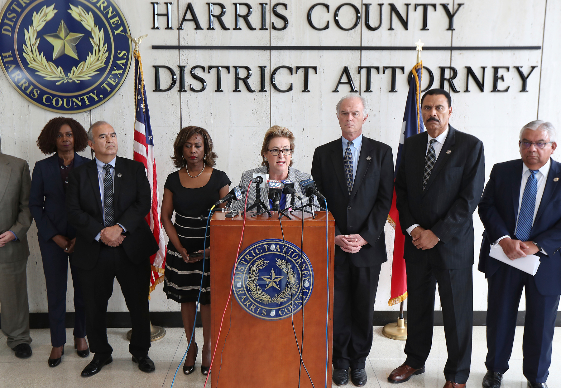 Harris County District Attorney Kim Ogg announces that her office has charged two officers in the Harding Street Raid Friday, Aug. 23, 2019, in Houston. A former Houston police officer has been charged with murder in connection with the deadly January drug raid of a home that killed a couple who lived there and injured five officers, prosecutors announced Friday.