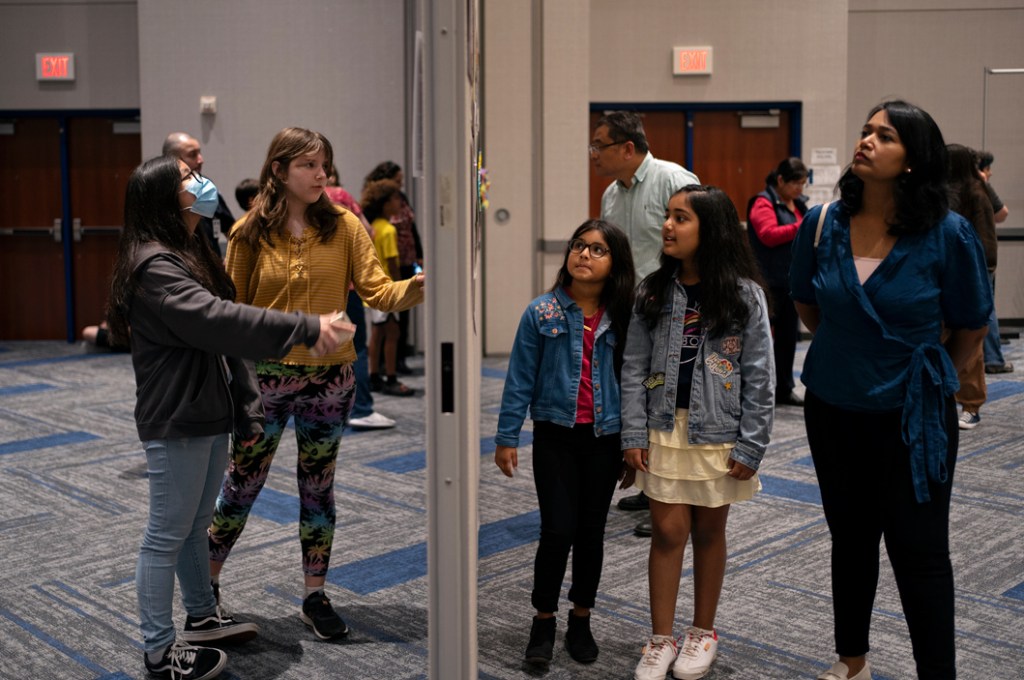Kids look at art
