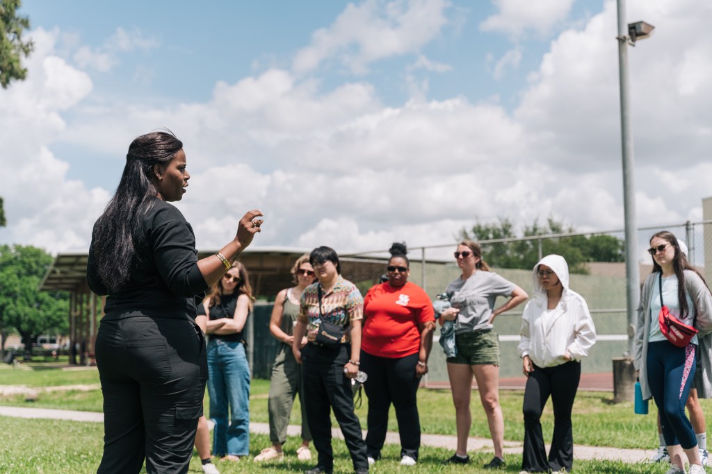 Kendra London, Fifth Ward native and community organizer, speaks with community members