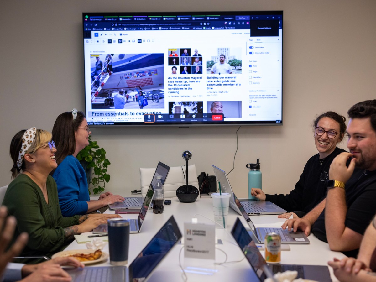 Journalist gather in a boardroom