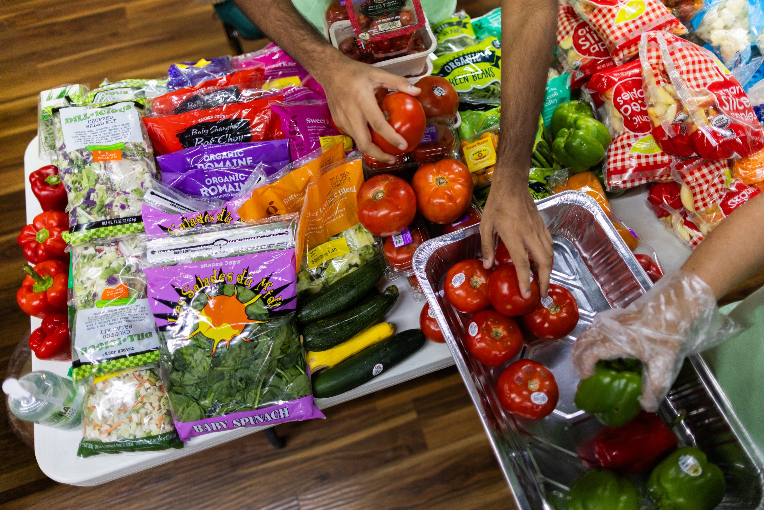 Volunteers prepare fresh produce to offer members of the community looking for accessible fresh food