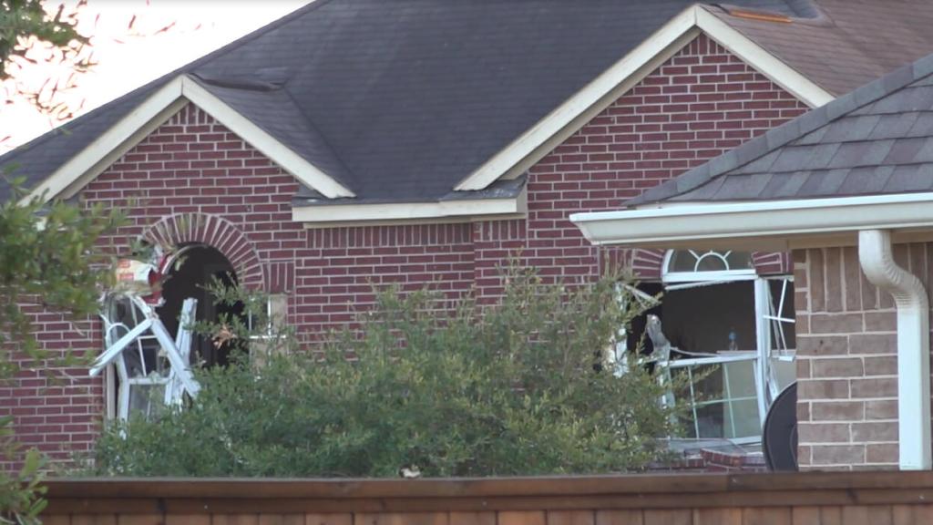 Police used heavy equipment to demolish part of a house in northeast Harris County where a gunman had fired at officers and barricaded himself. 