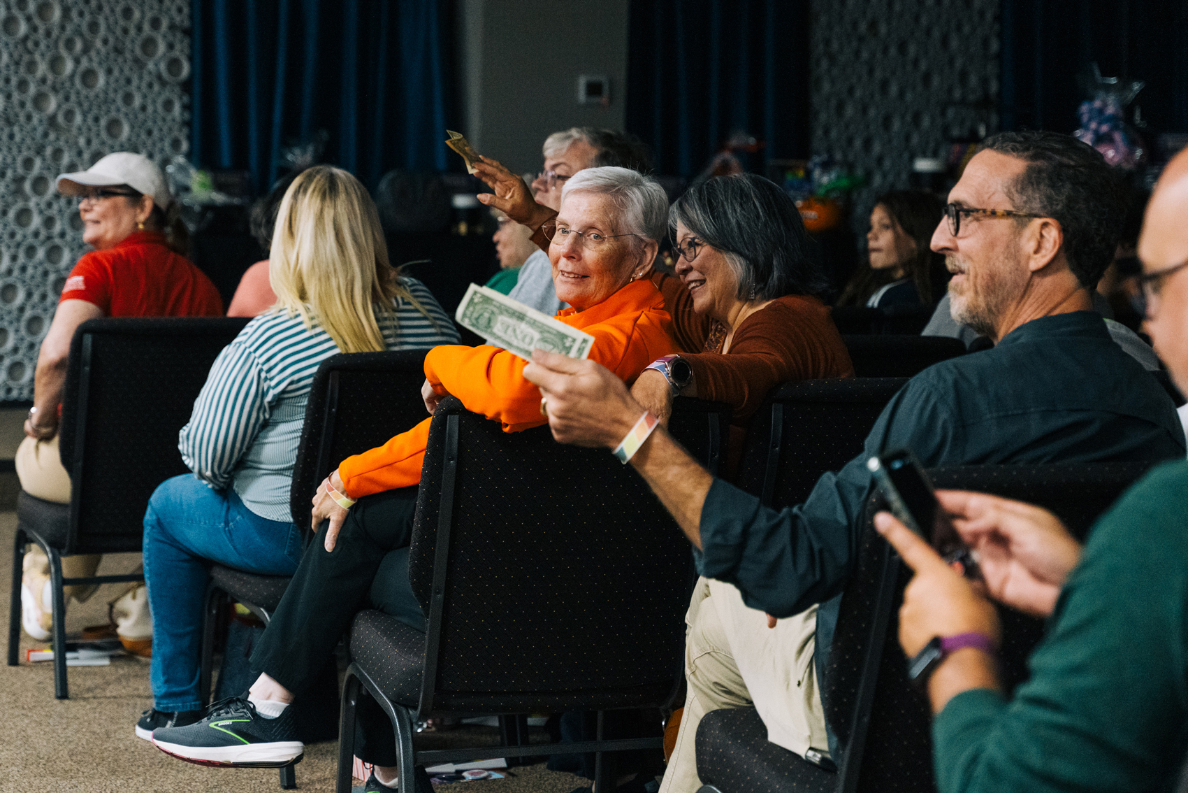 Festival attendees cheer for the drag queens’ performances at the after party, “Wicked with the Queens,” at First Christian Church