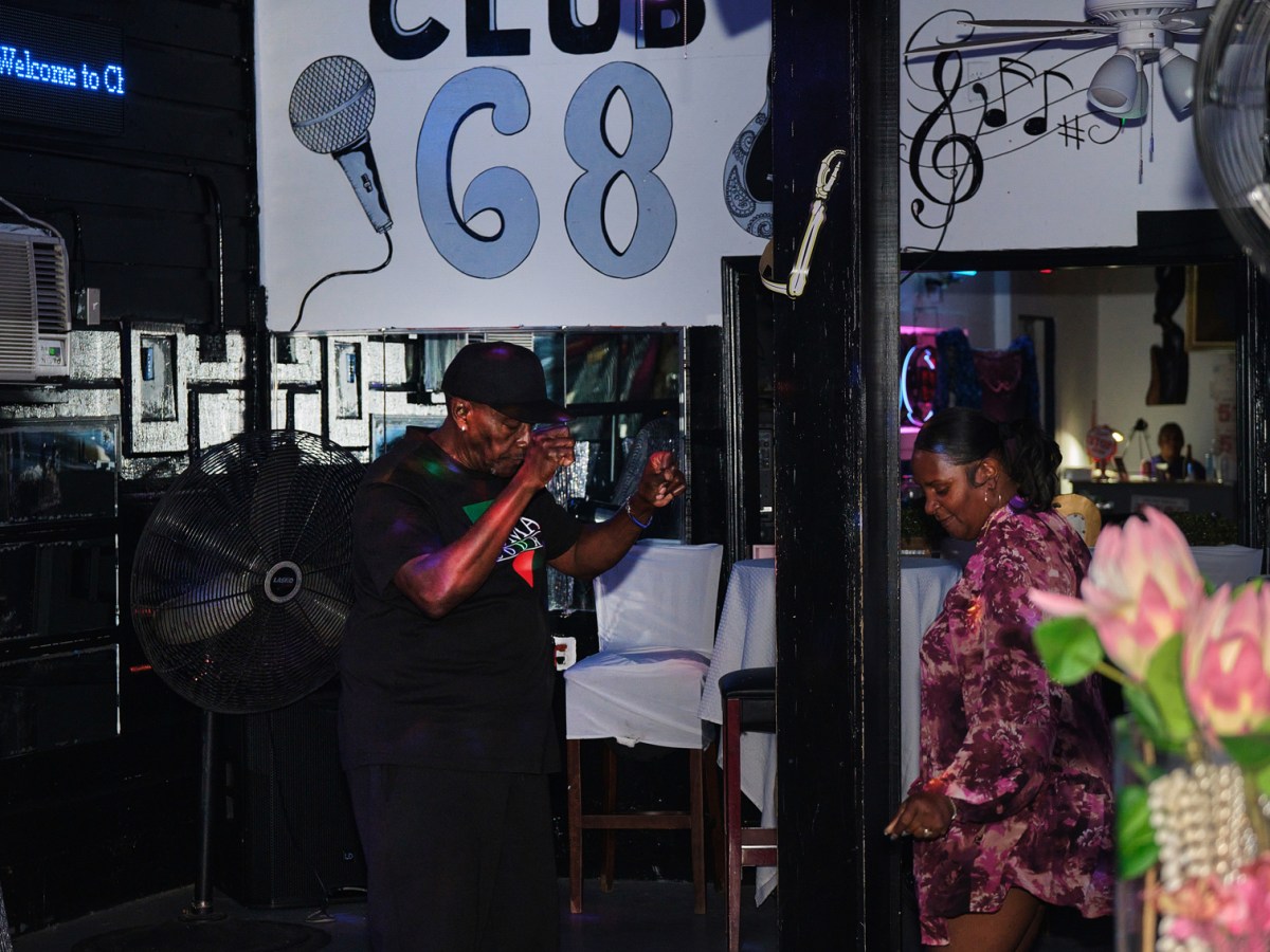 Rosalyn Jackson, right, owner of Club 68, a long-time gathering spot for the Black community in Galveston, dances with Darnell Durry