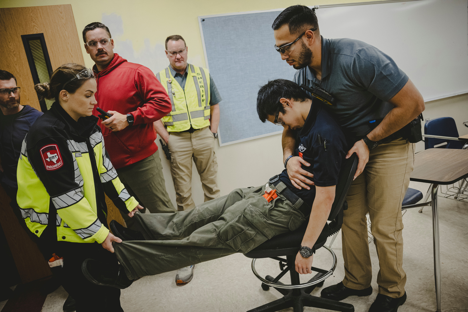 Montgomery County sheriff’s deputies and Montgomery County hospital district EMS personnel practice evacuating victims with gunshot wounds while training together for how to respond to a mass shooting