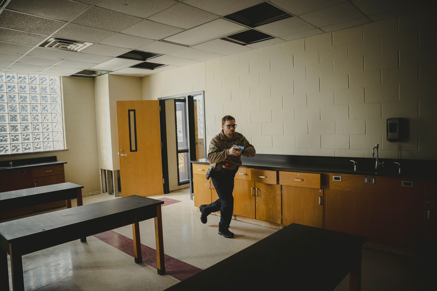 Montgomery County Sheriff’s deputies enter a classroom while training to respond to an active shooter, on Nov. 28 in New Caney.
