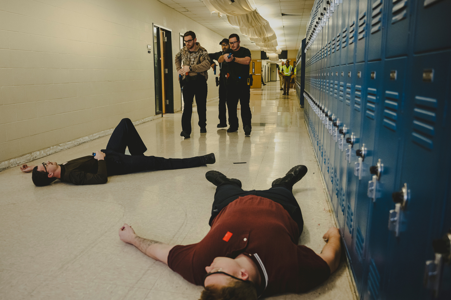 Montgomery County sheriff’s deputies practice shooting a colleague that was role-playing as an active school shooter during a training exercise in New Caney. 
